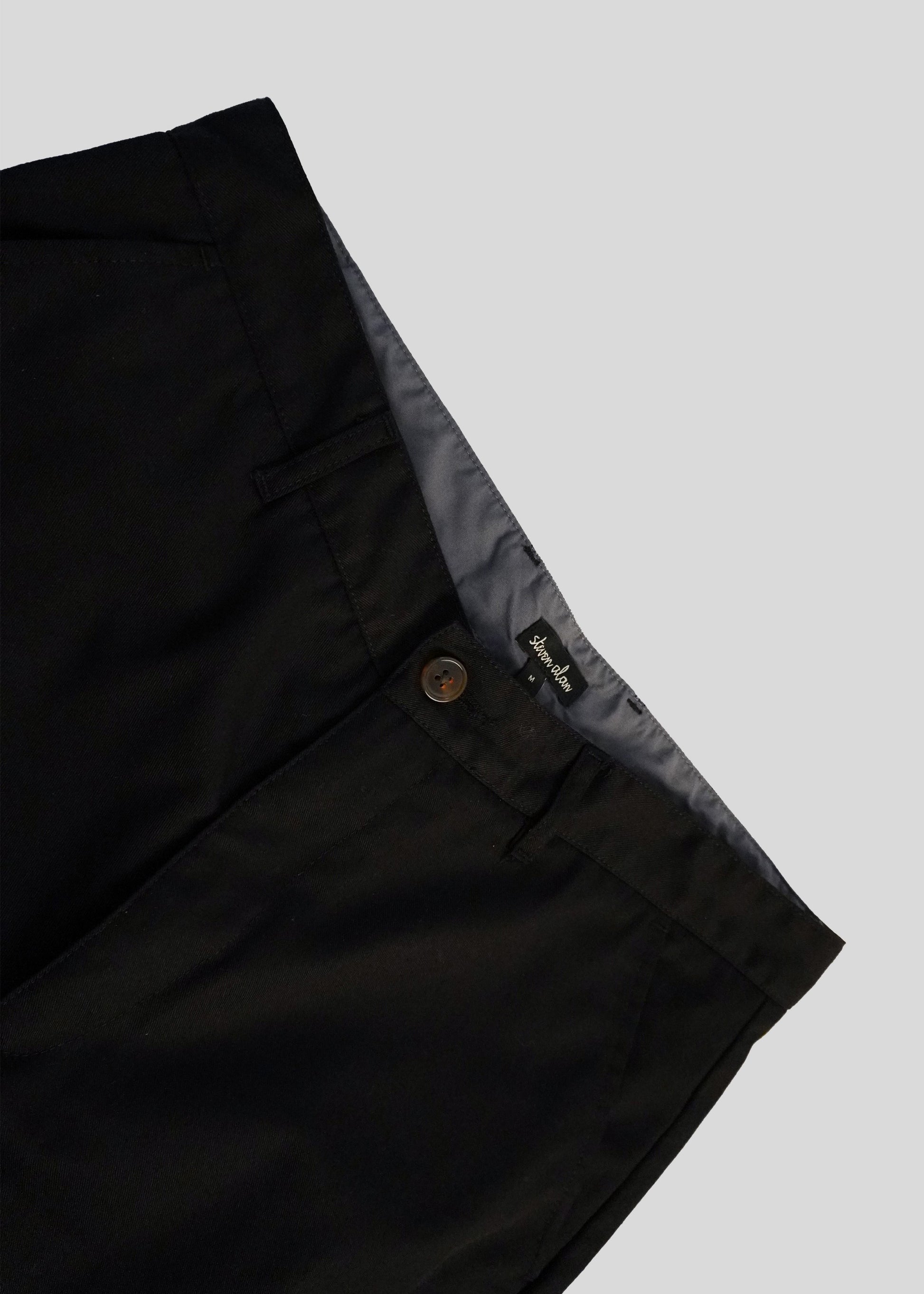 Close up of lightweight danver pant in color black