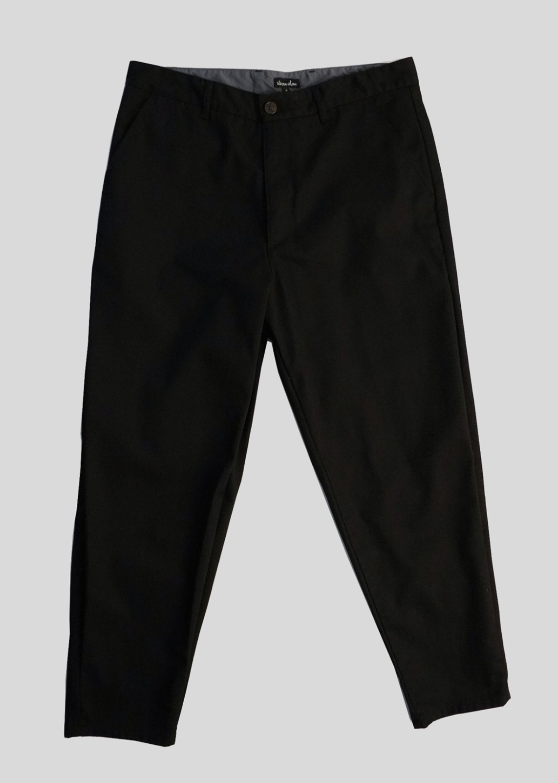 Front flat lay of lightweight danver pants in color black