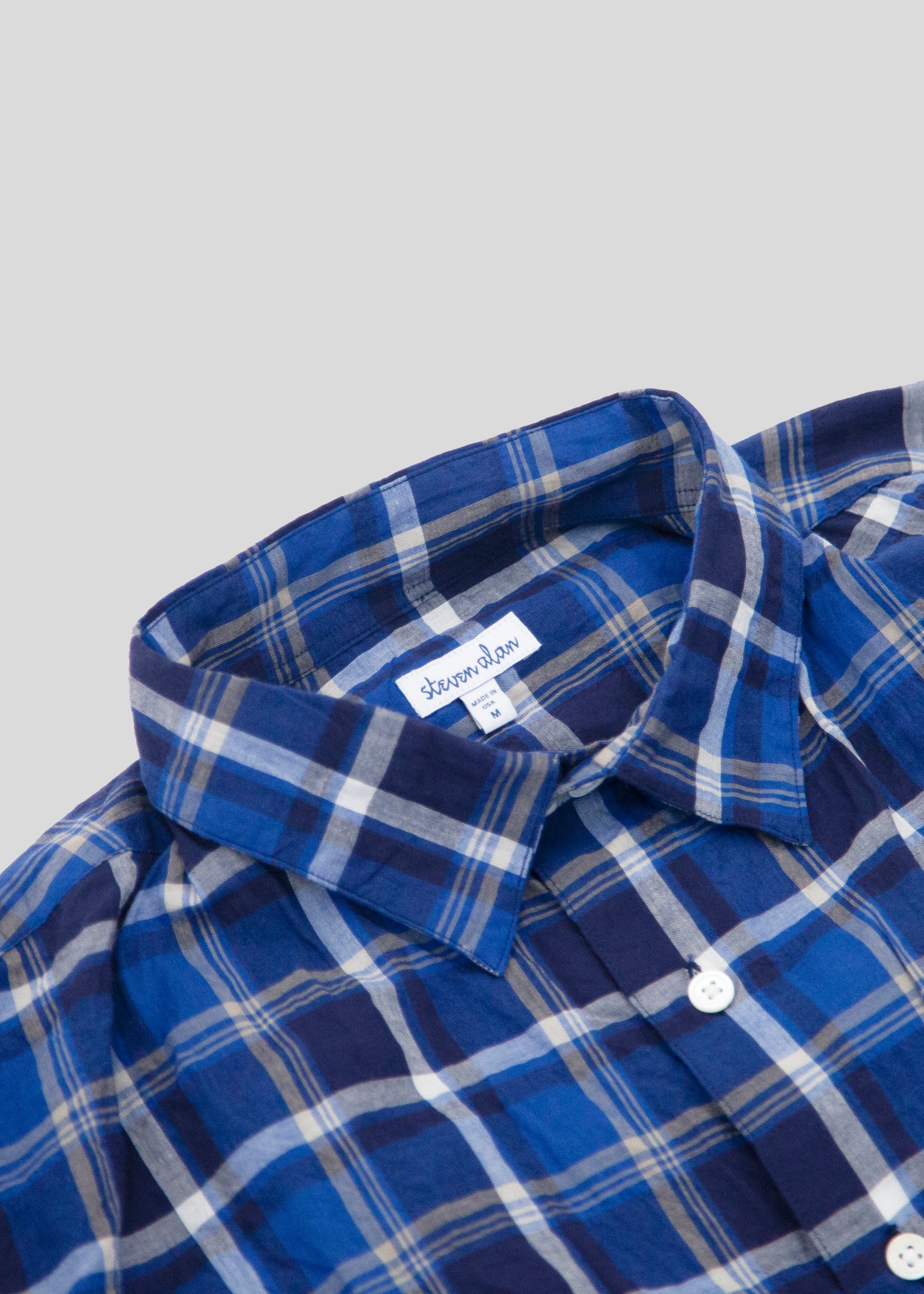 close up of Front flat lay of notch shirt in color blue check