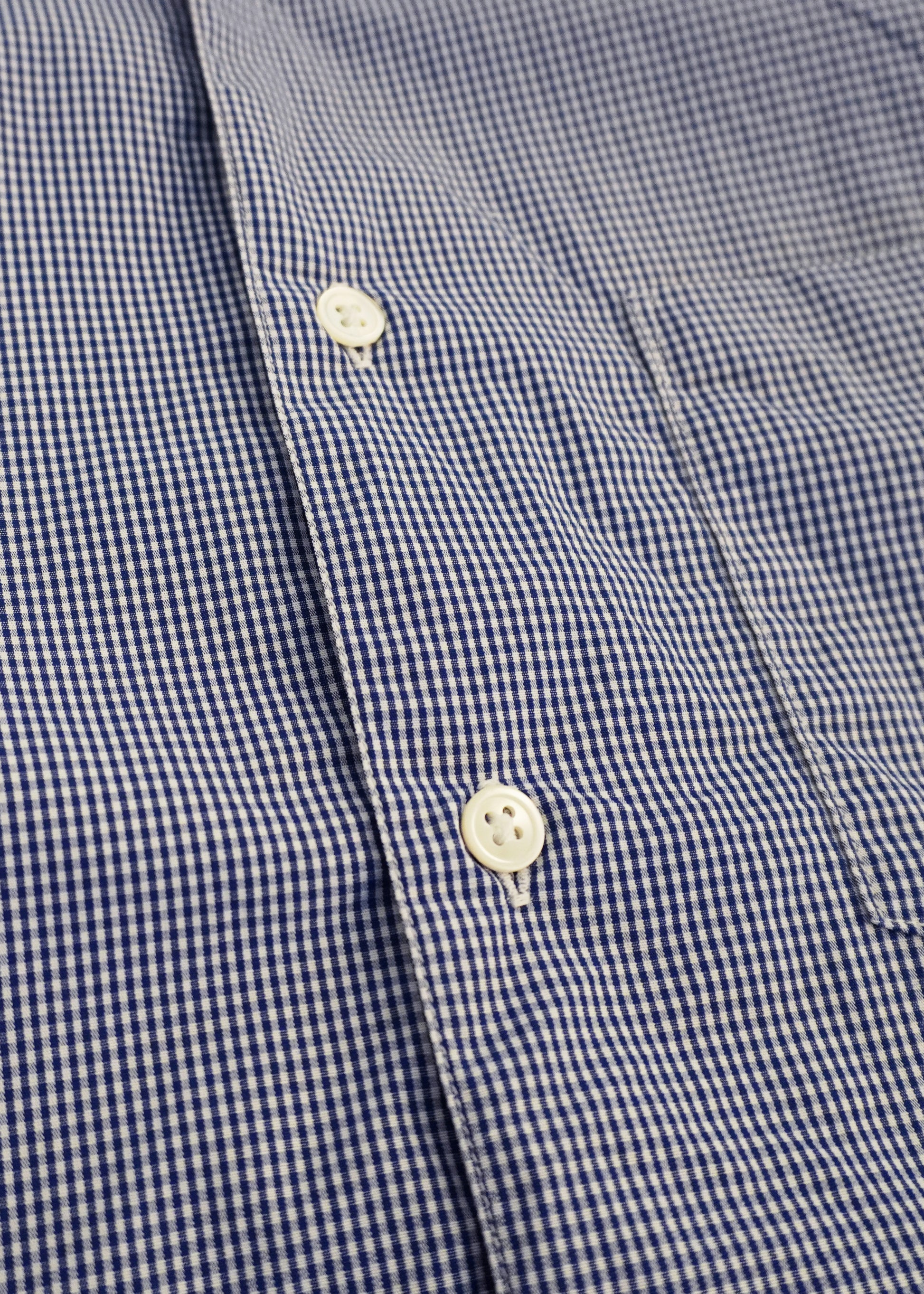 close up of seams and buttons of single needle shirt mini gingham blue 