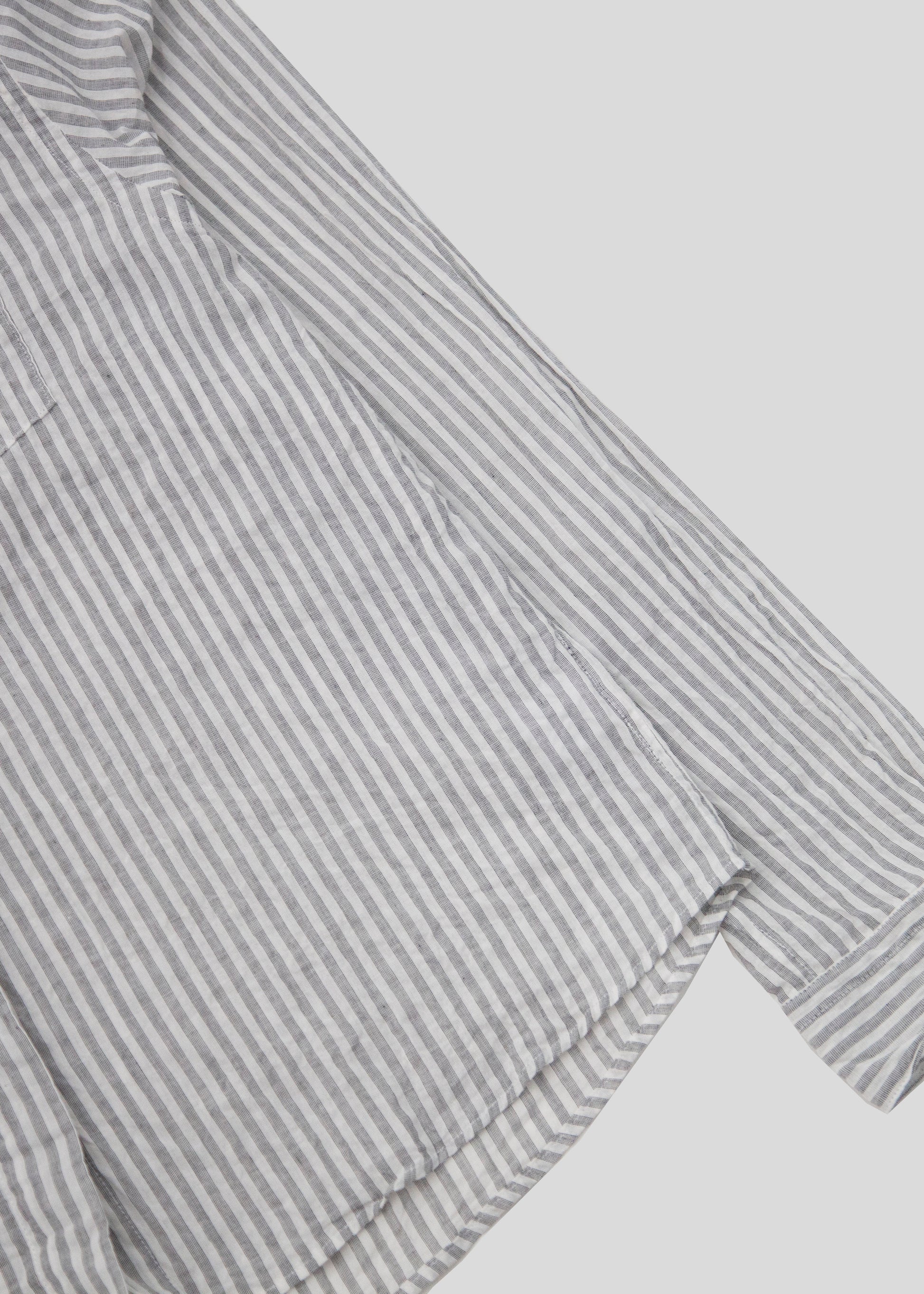 front sleeve close up of front flat lay fly shirt color grey stripe