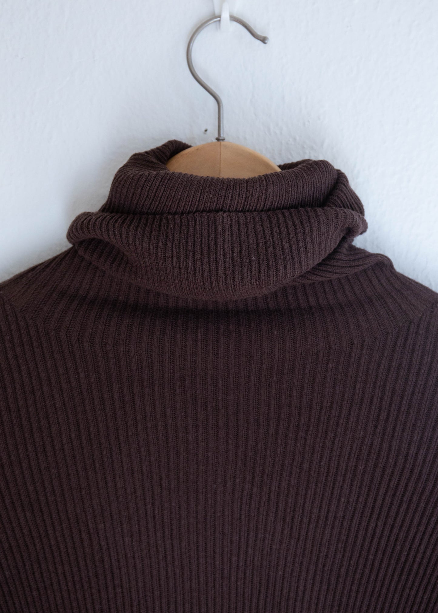 Close up of turtleneck pullover in color brown 