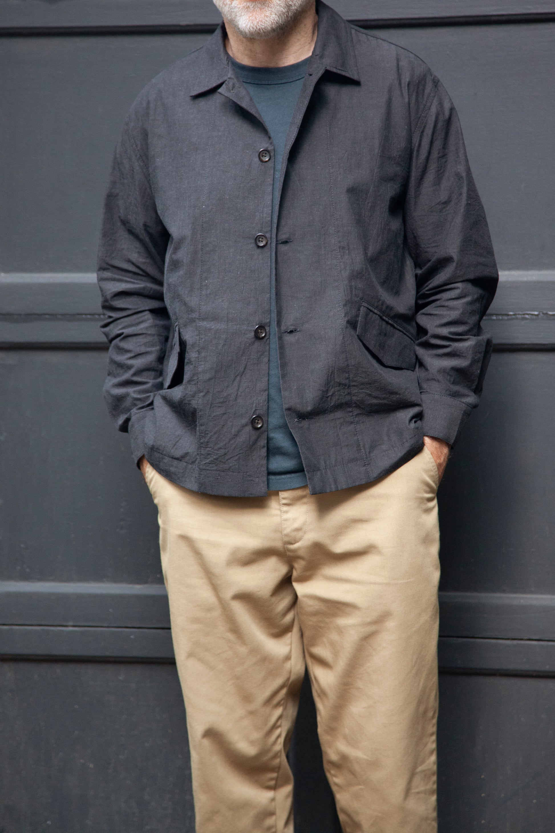 Front Male model wearing the painter shirt in slate grey, khaki pants and grey t-shirt