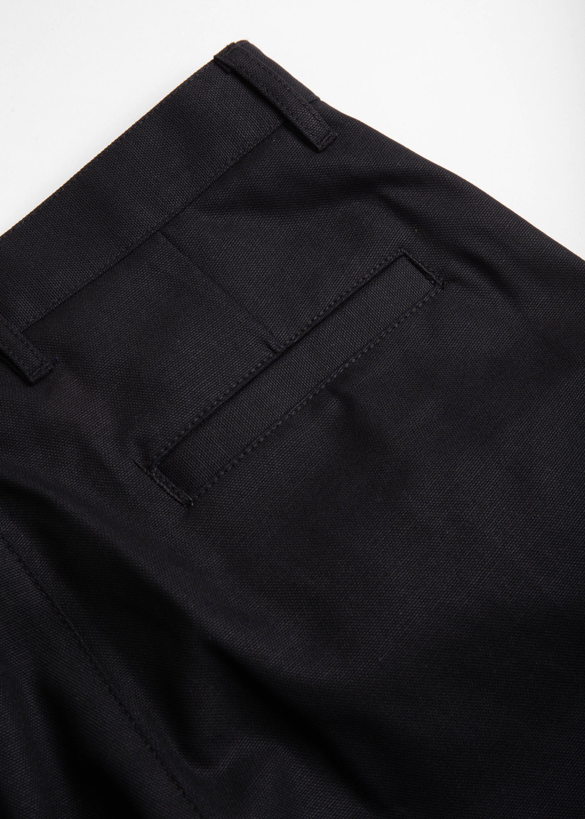 close up of danver pant color black back pocket