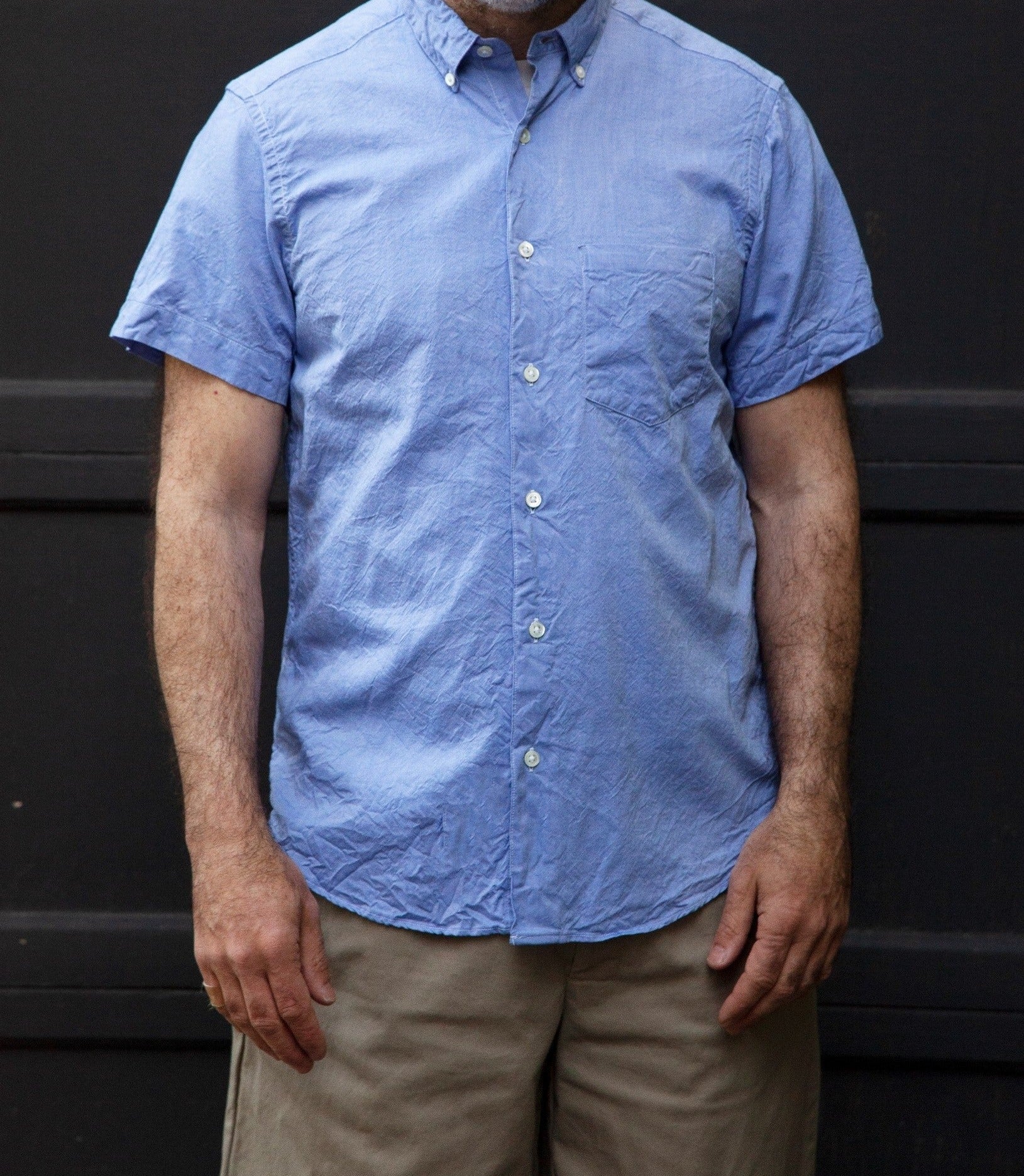 Short Sleeve Single Needle Shirt in light blue cirnkle cotton  and khaki pants on model front