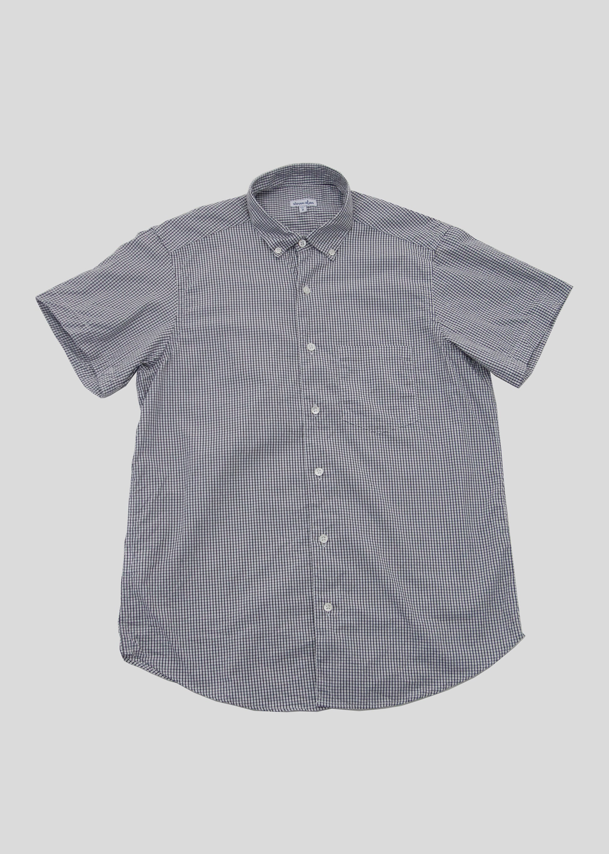 Front flat lay of short sleeve single needle shirt in color gingham black and white