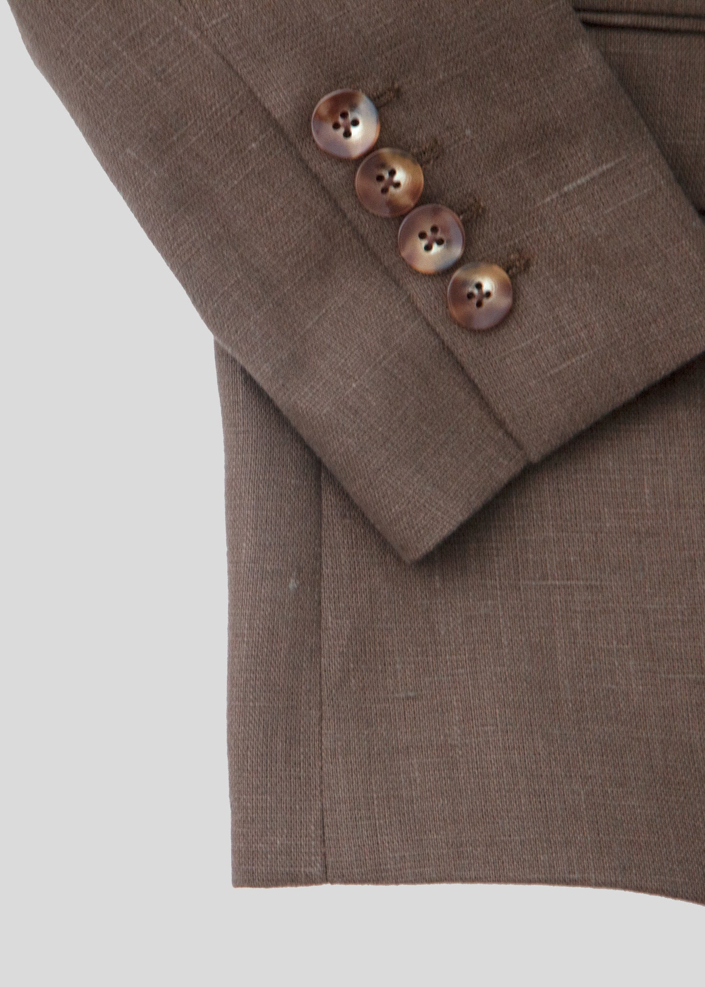 Close up of blazer sleeve buttons