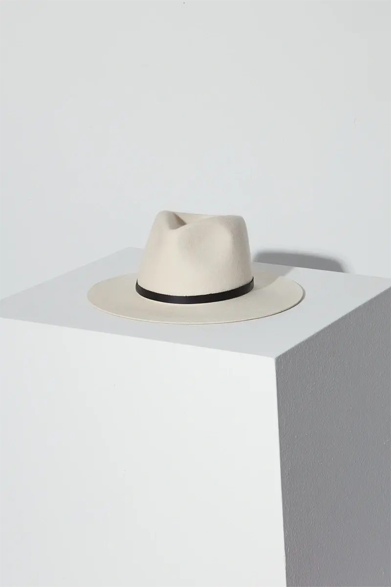 Luca fedora hat in color cream on top of white block