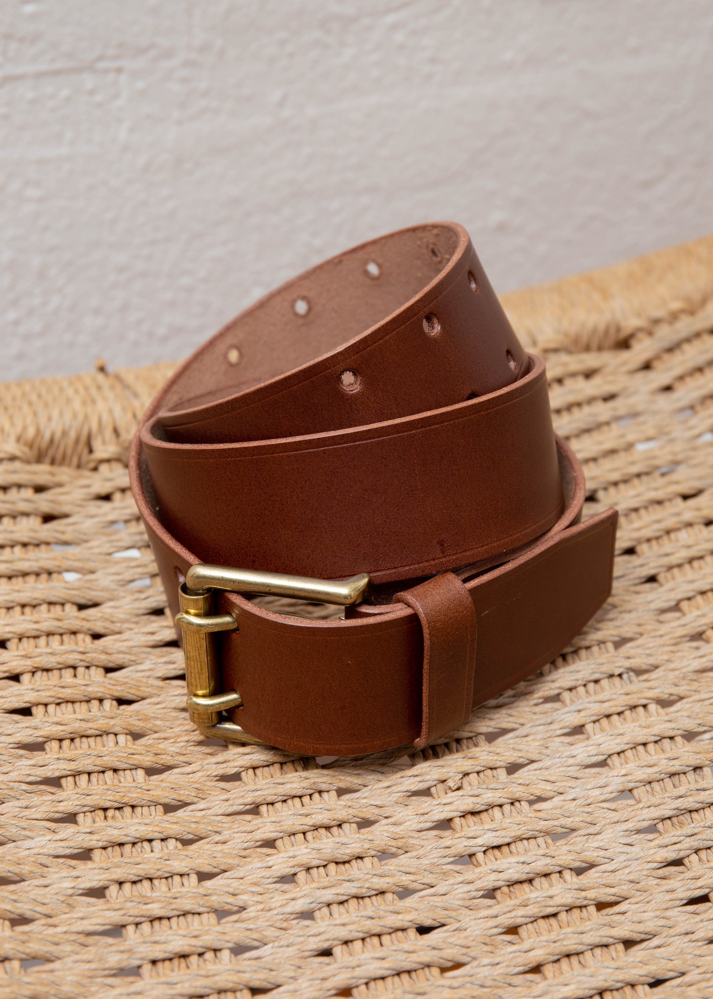 Close up of cow leather belt in color dark brown folded