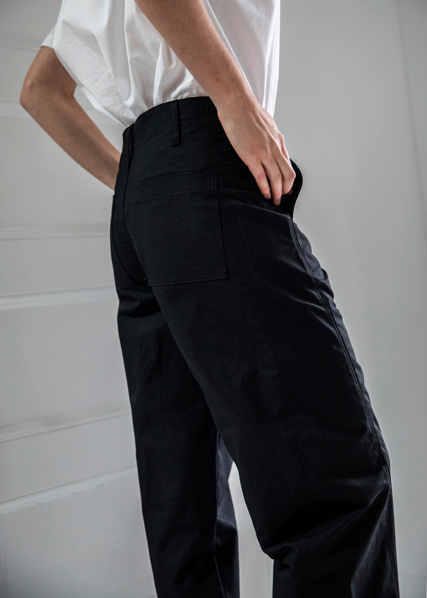 side shot of slacker pants in color black on model 