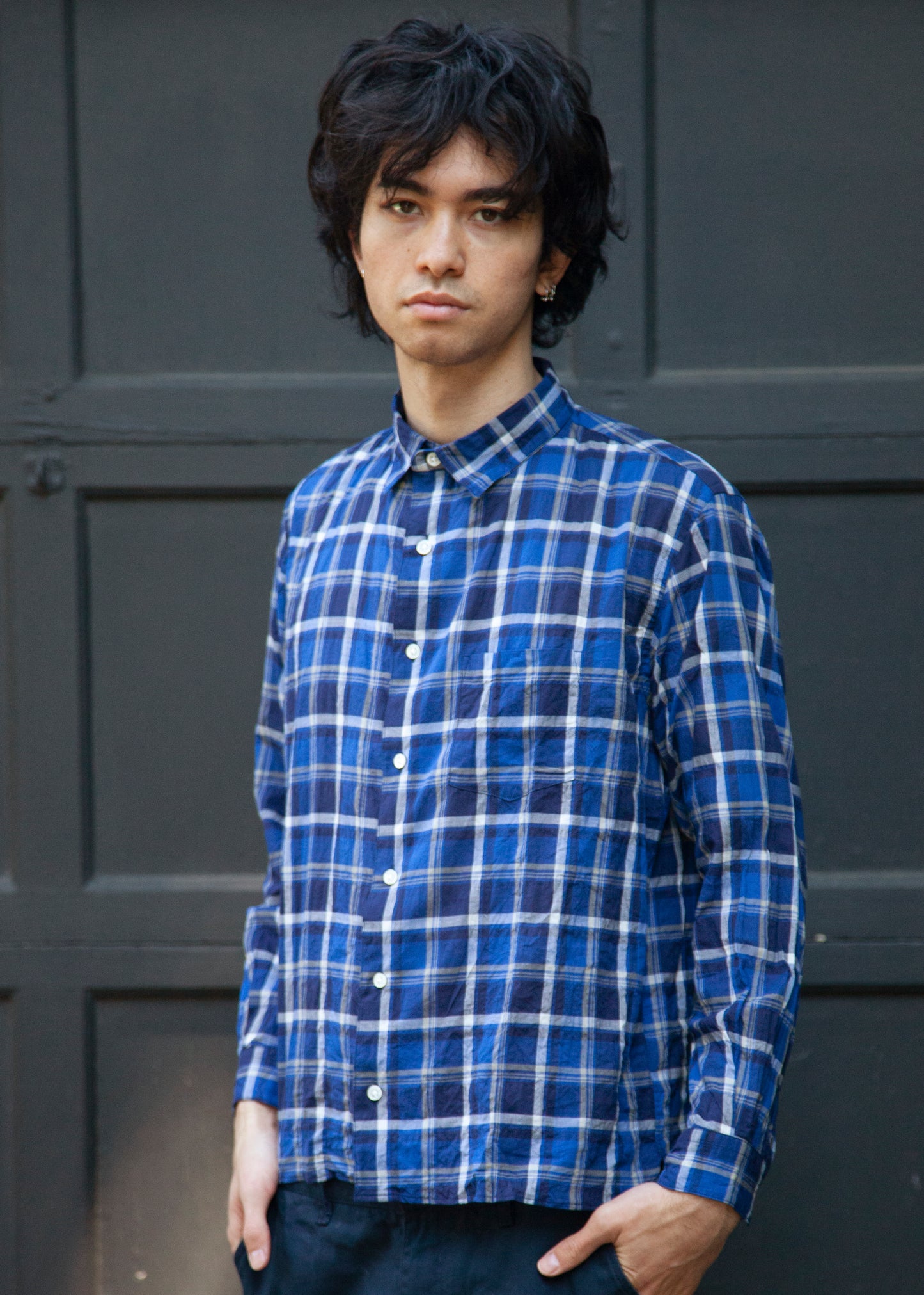 The notch shirt in color blue check on model front