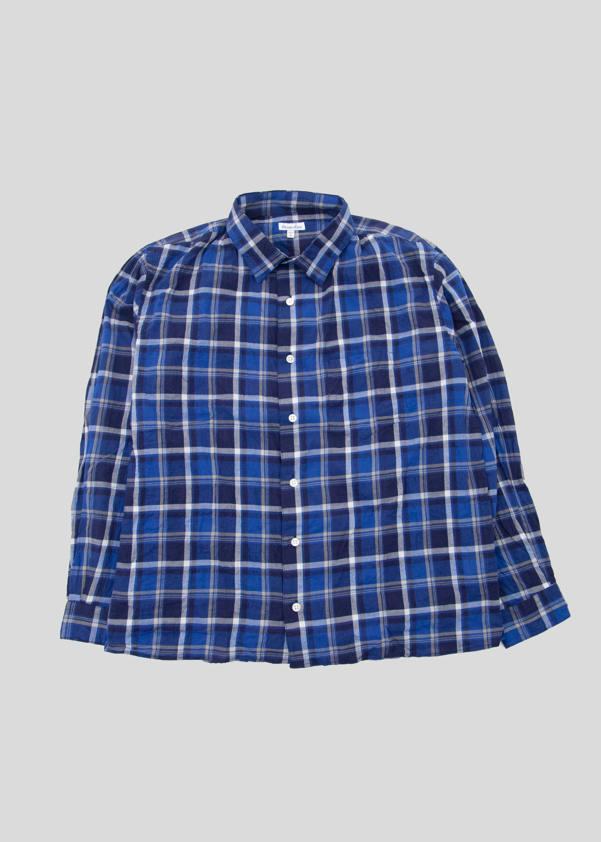Front flat lay of notch shirt in color blue check