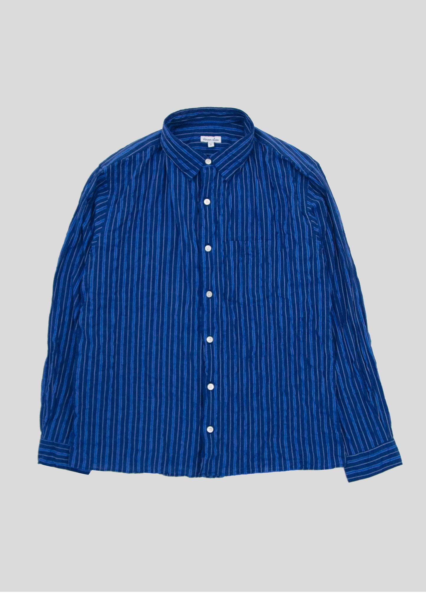 Front flat lay of notch shirt in color dark blue stripe