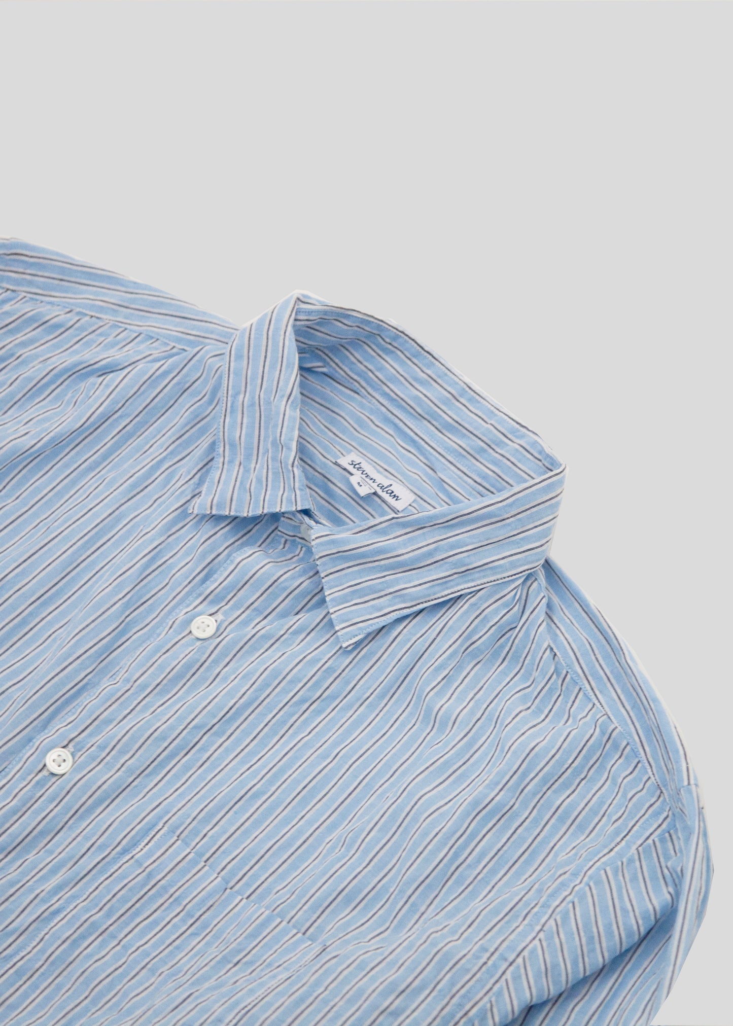 close up Front flat lay of notch shirt in color light blue stripe