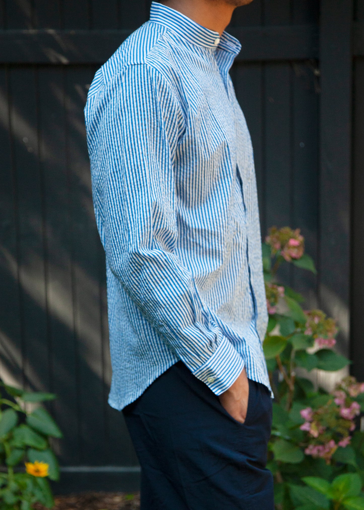 tux shirt in color blue stripe on model side