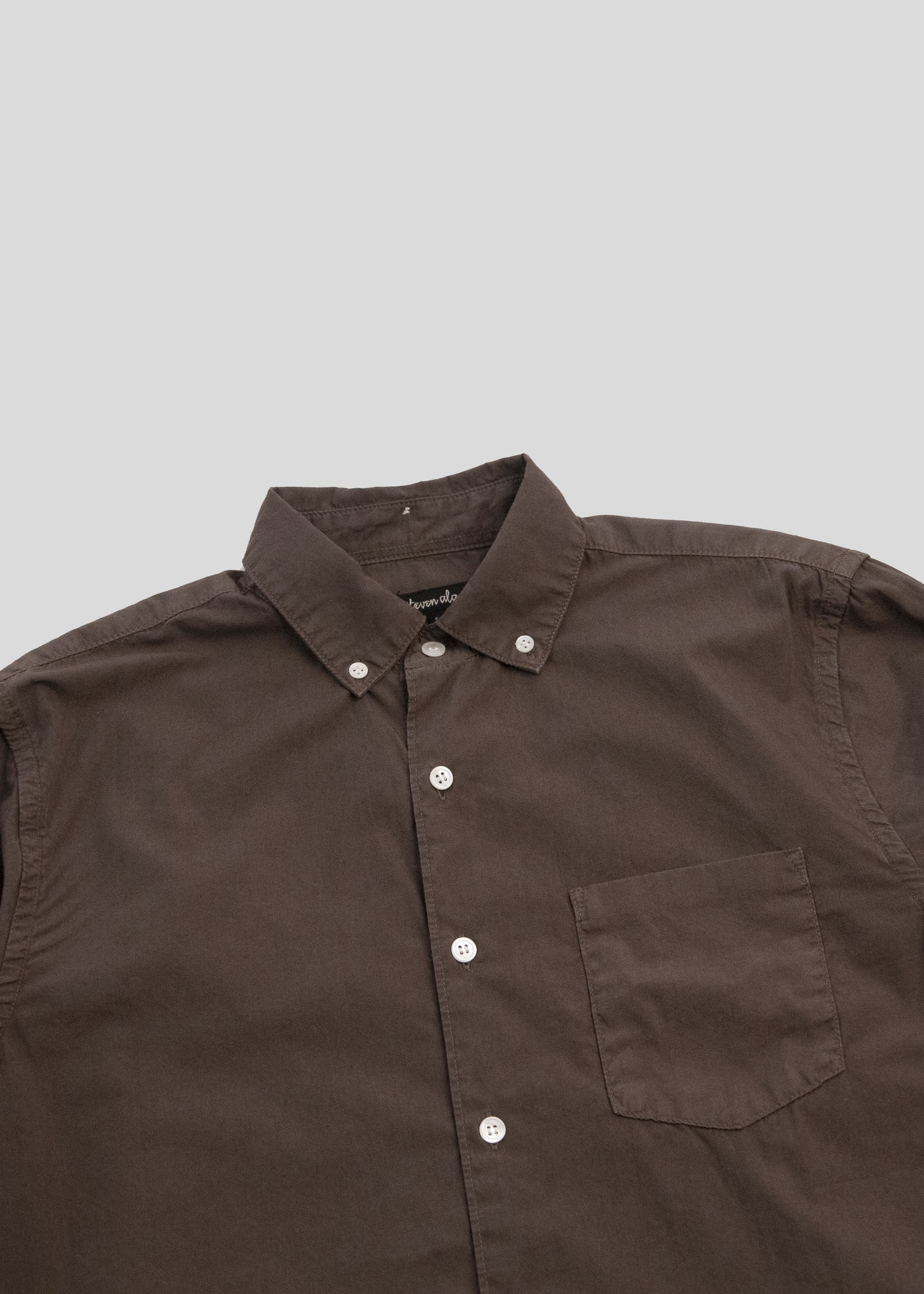 close up front flat lay of washed poplin shirt in color coffee