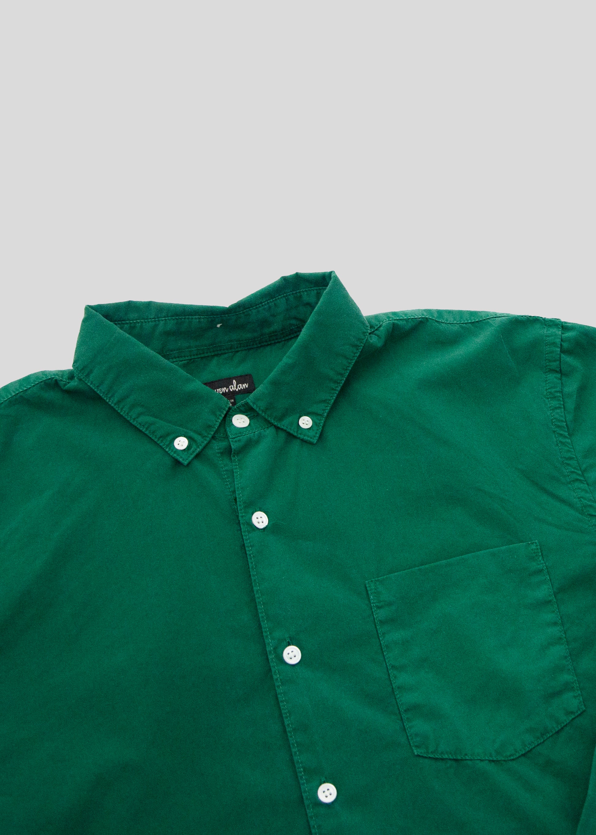 close up front flat lay of washed poplin shirt in kaitoke green