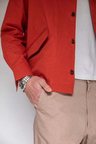 close up of model side wearing a silver watch, painter shirt with a white t-shirt and maker pants