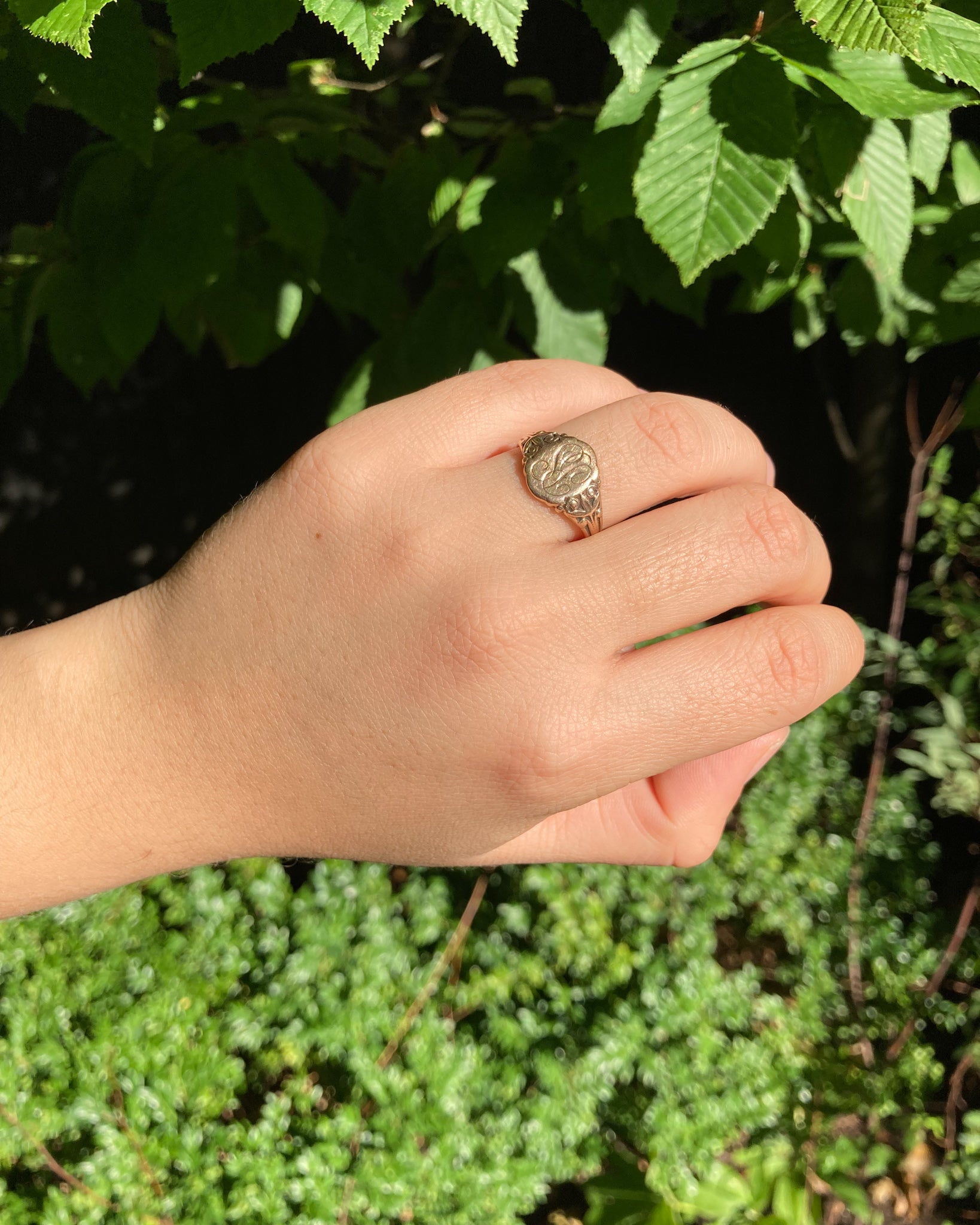 vintage signet ring on model hand close up