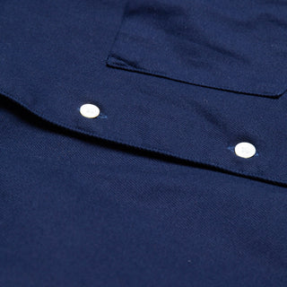 Close up of seams and buttons of single needle shirt in deep navy canvas