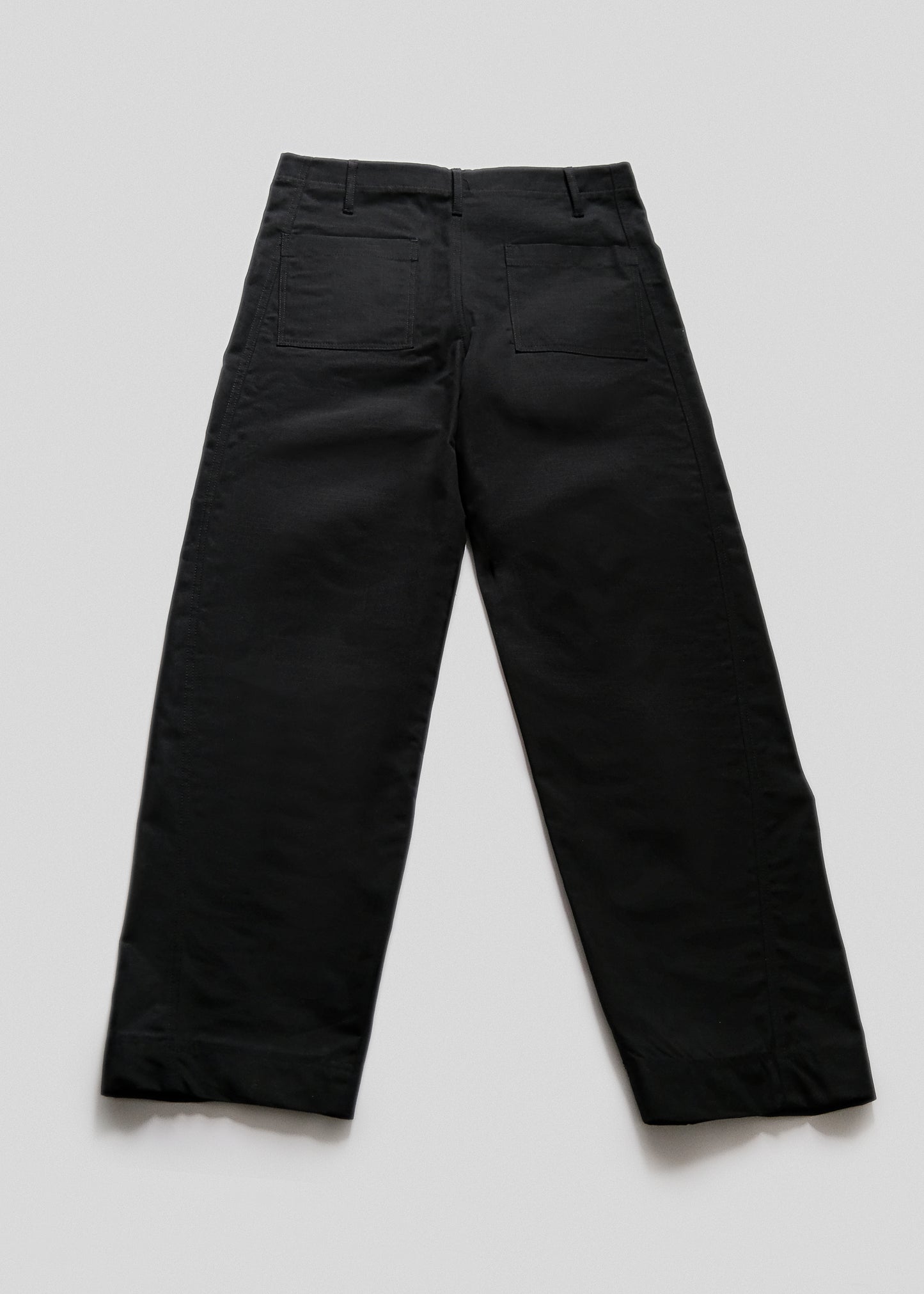 flat back lay of slacker pants in color black