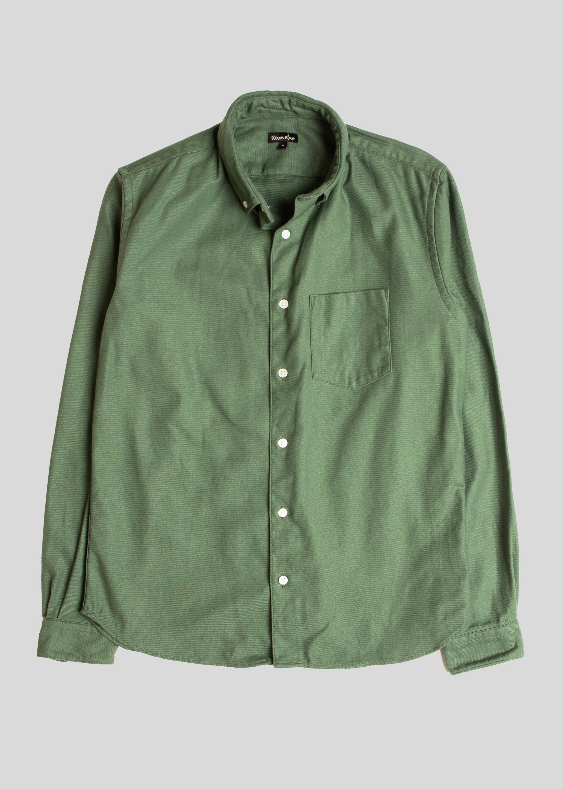 Front flat lay of single needle shirt in bottle green canvas