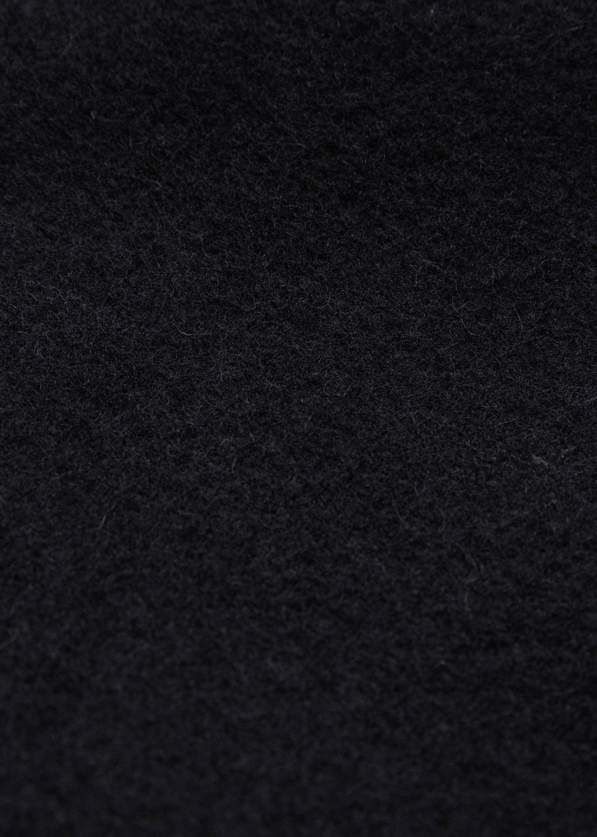 Close up of the black melton wool fabric 